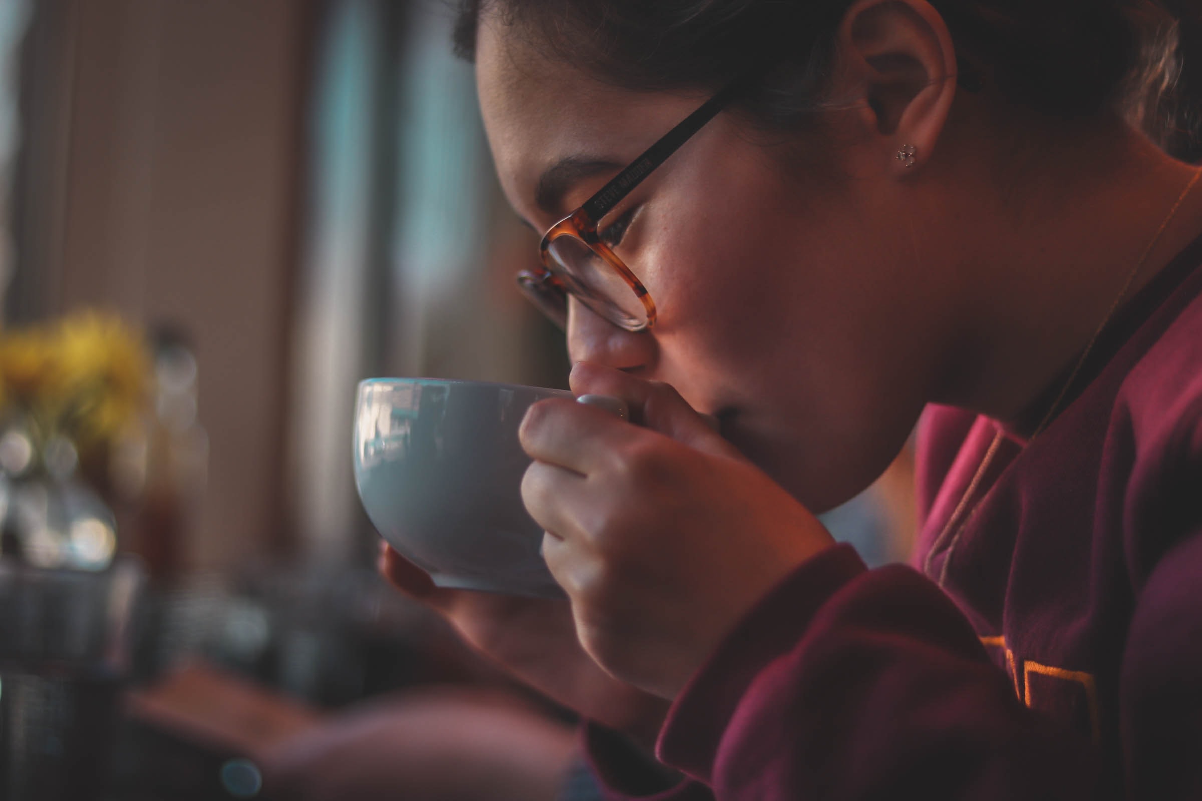 Chinese woman drinking warm hot coffe debunking coffee myths LIFEXPE