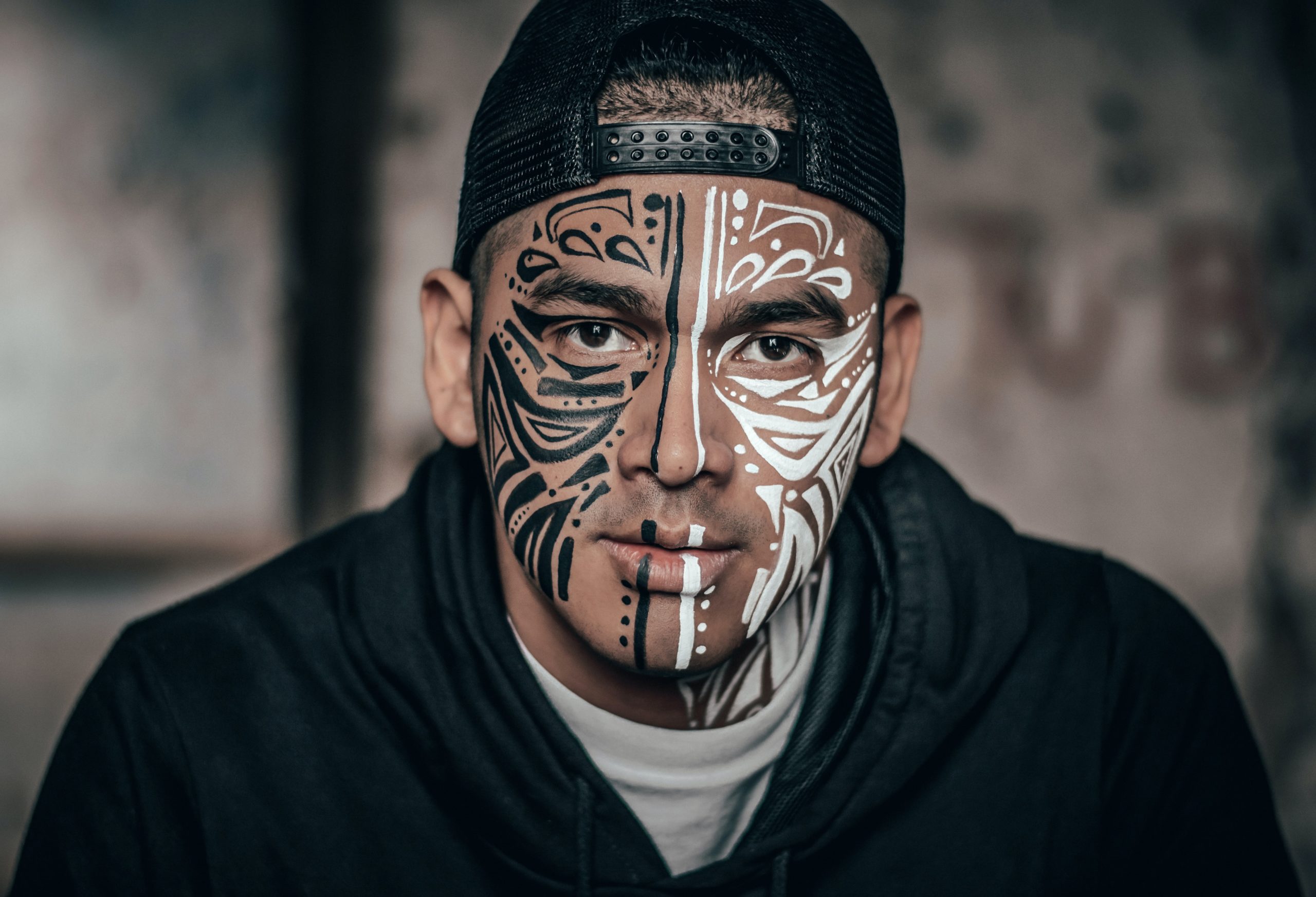 Man with face tribal design tatoo quote smile every individual matters lifexpe